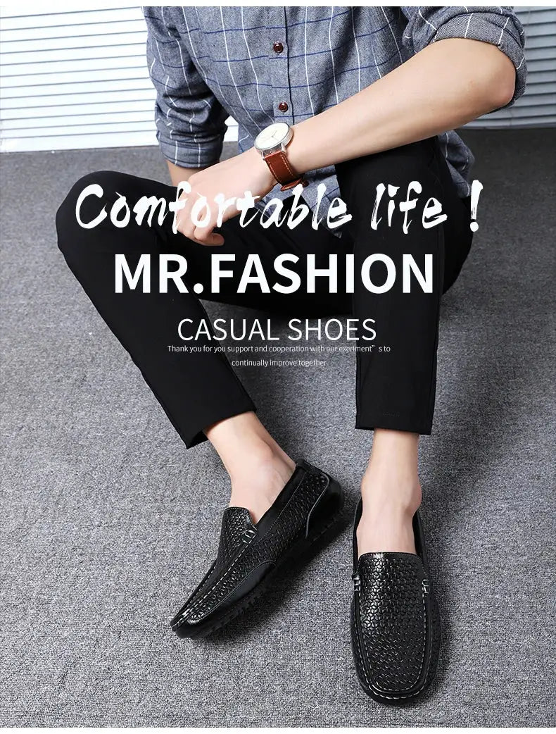 Pair of black genuine leather men's loafers with textured surface; slip-on driving moccasins.
