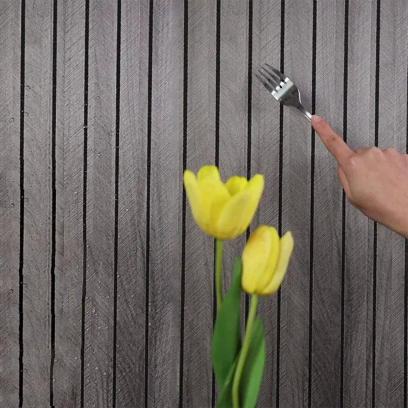 3M New Grille 3D wall sticker with dark wood grain panels; foreground two yellow tulips and a hand holding a fork.
