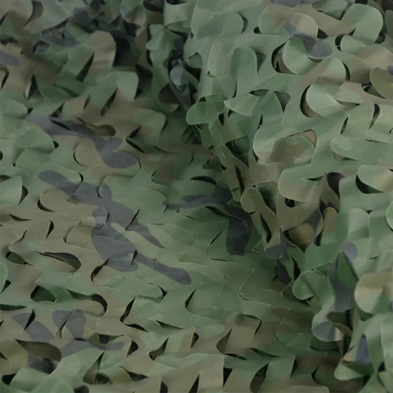 Military camouflage netting in green camo with leaf-like shapes