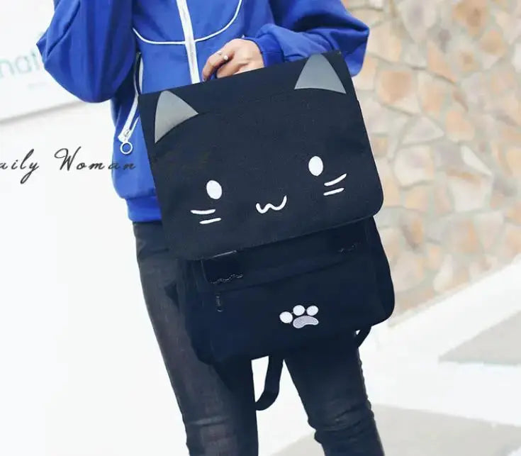 Simples Market Japanese Stupid Cute 3D Cat Backpack; black cat-face flap and paw-print pocket, large school bag