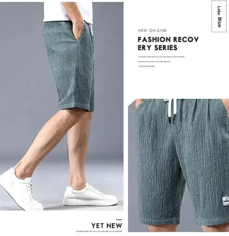 Men's ice silk casual shorts, blue-gray textured fabric with drawstring waist, loose fit.