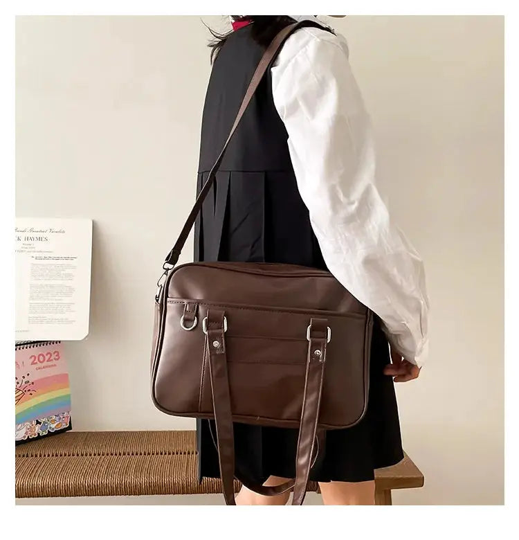 Japanese Style JK Bag brown PU leather shoulder bag for women with crossbody strap and dual buckle straps