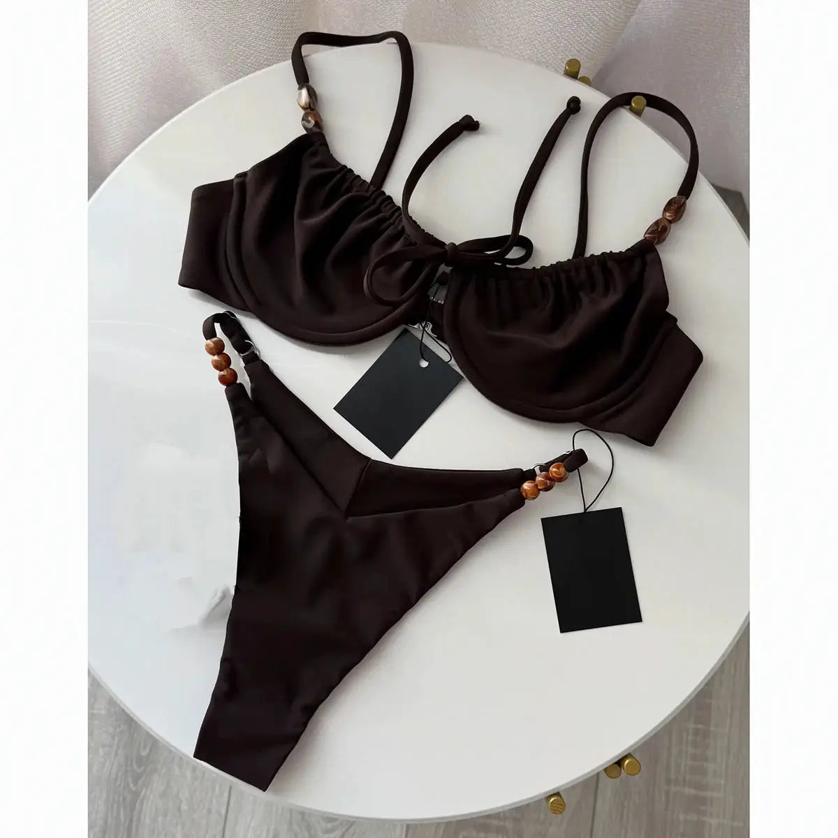 Two-piece push-up bikini set in dark brown with beaded straps and wooden bead accents, Simples Market beachwear.