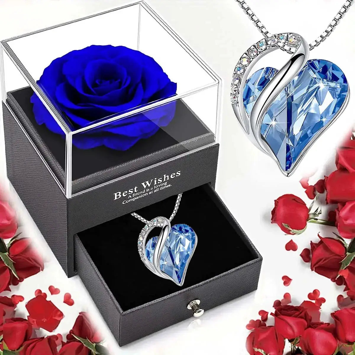 Necklace with blue heart-cut crystal pendant in a silver setting, shown in a black jewelry gift box