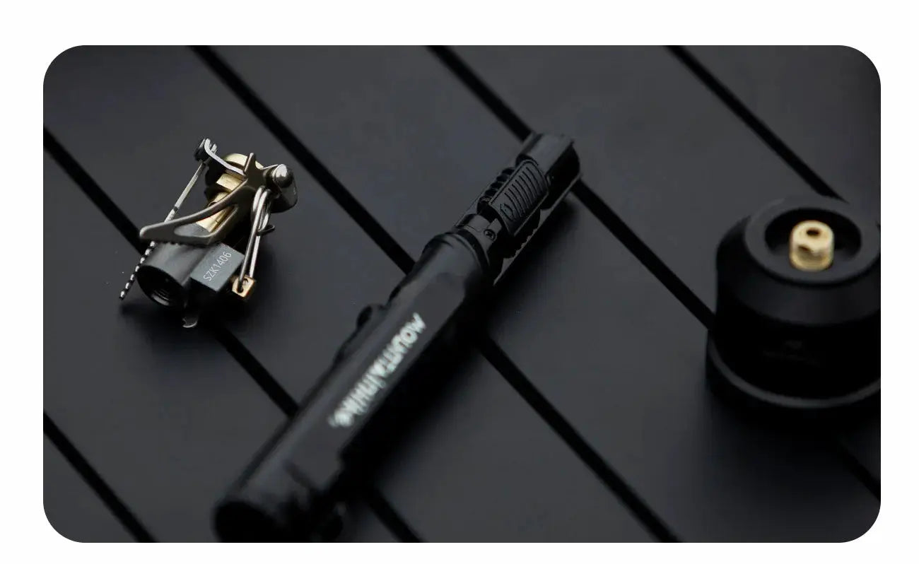 Mini pocket camping stove 3-piece set by Simples Market: black folding burner, compact control unit, gas canister.