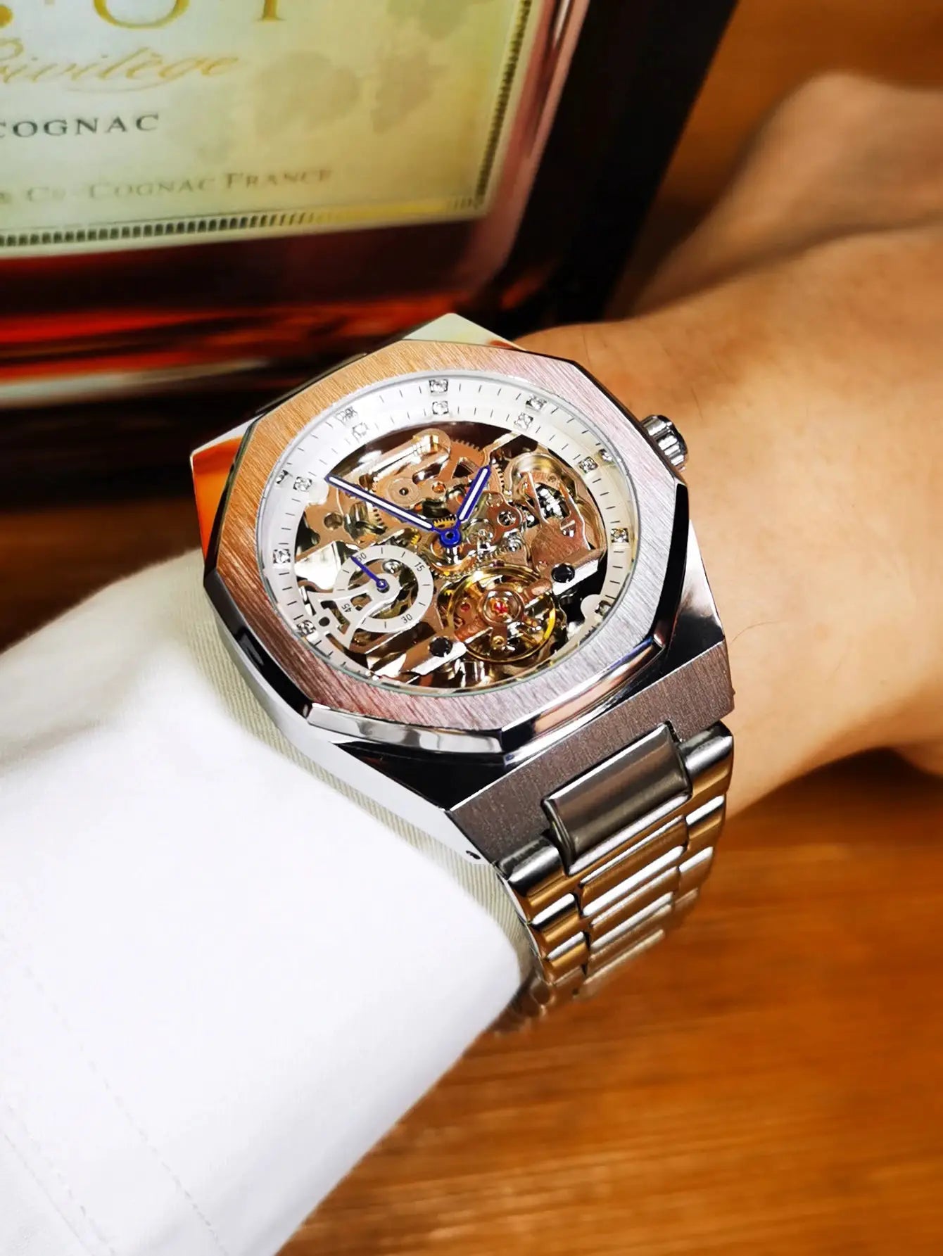 Forsining men's skeleton automatic watch with stainless steel bracelet and luminous blue hands