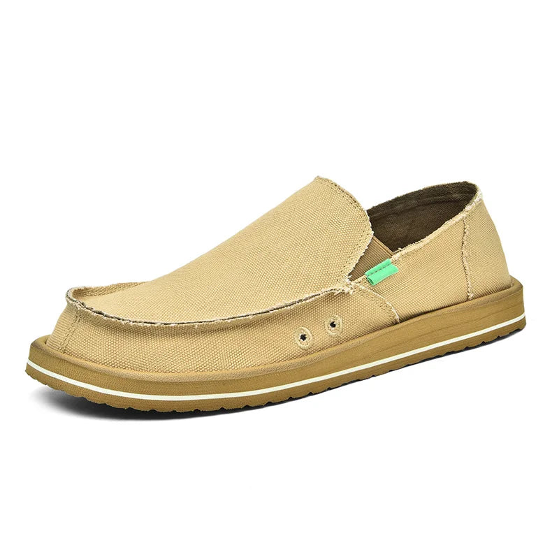 Casual men's canvas loafers slip-on, tan breathable low-top sneakers with a beige sole and visible stitching.