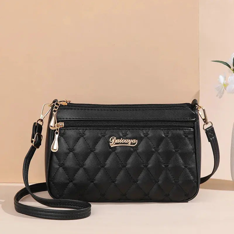 NovaLuxe PU Leather Messenger Bag For Women With Fur Ball Accent And Secure Zipper Closure