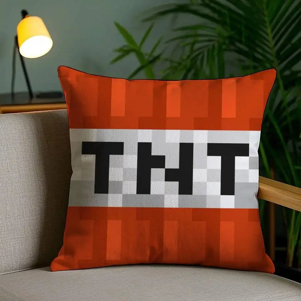 Pillow cover featuring orange TNT block explosion design with white central stripe and bold black TNT letters.