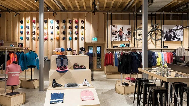 Rvouei team cycling jersey set by Simples Market on display in a sports apparel shop; colorful breathable road wear.