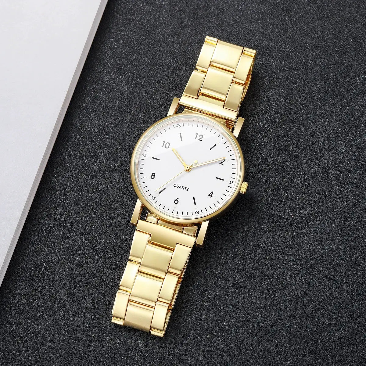 Gold-tone women's quartz watch with bracelet metal band and Arabic numeral dial