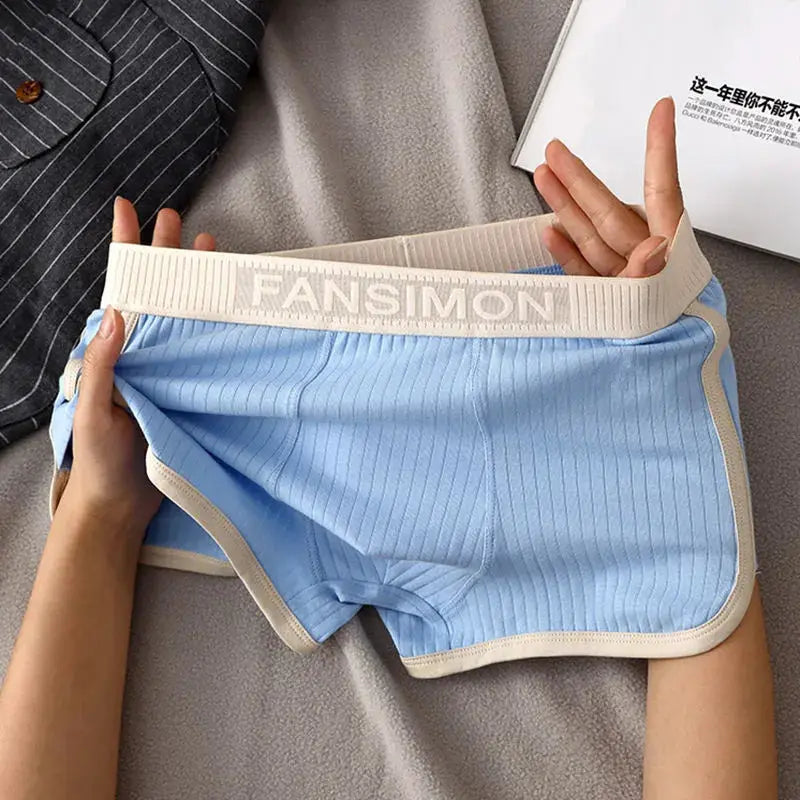 Men's striped boxer shorts in light blue with beige trim and a branded FANSIMON waistband