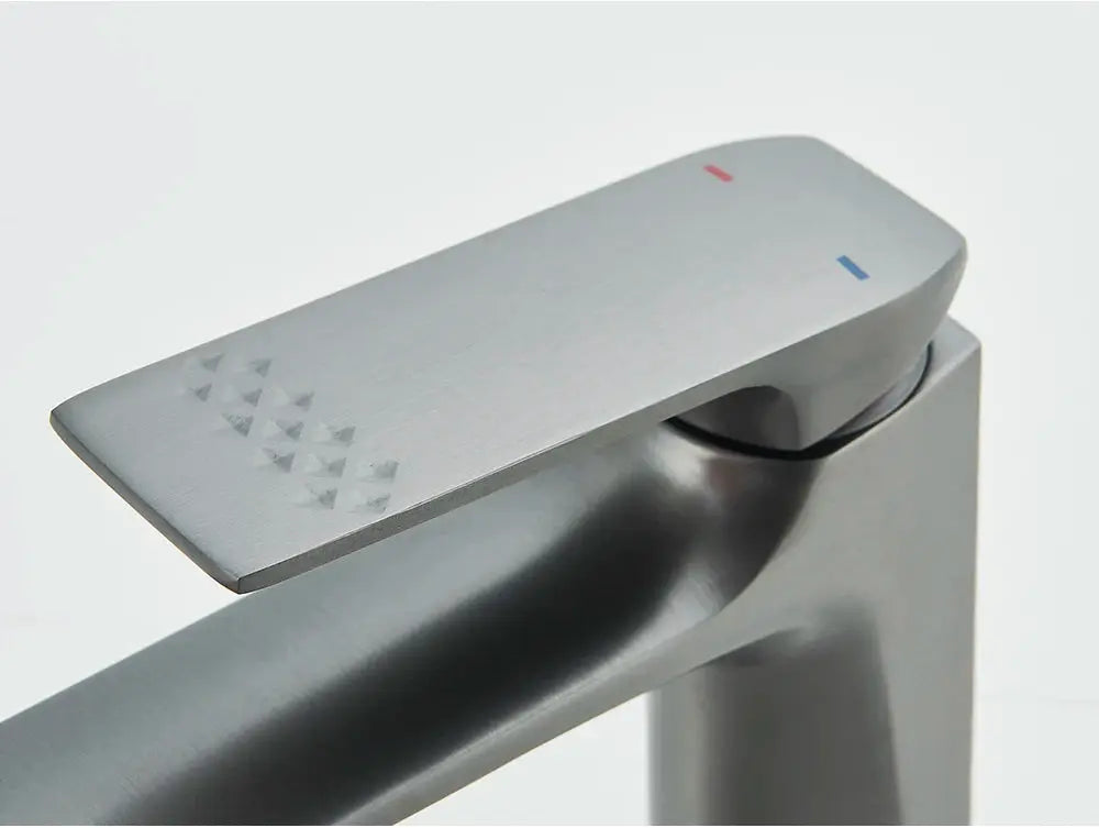 Deck-mounted bathroom faucet with brushed stainless steel finish and single lever control