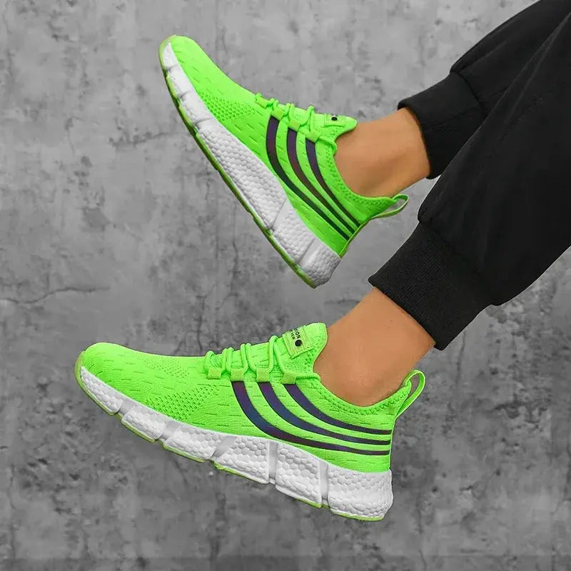 Men's neon green breathable running sneakers with dark blue stripes and white cushioned platform sole