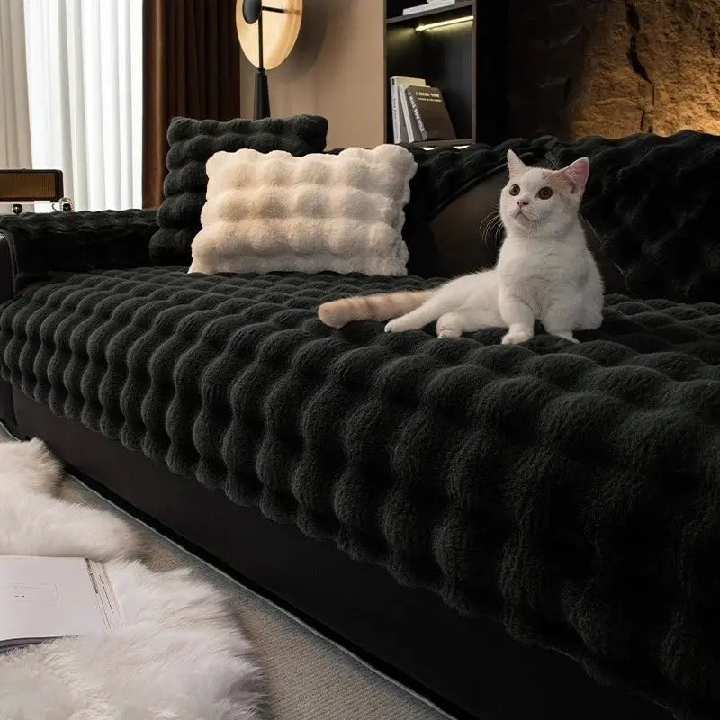 Thick faux rabbit fur sofa slipcover in black on a modern living room couch
