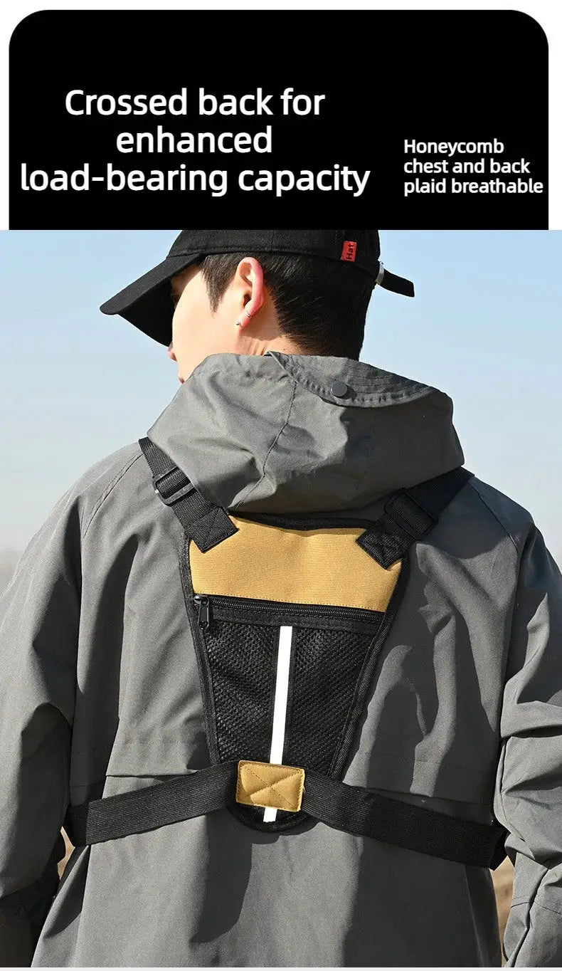 Outdoor tactical chest bag for men worn on back with gray jacket, tan top panel and black mesh pocket.