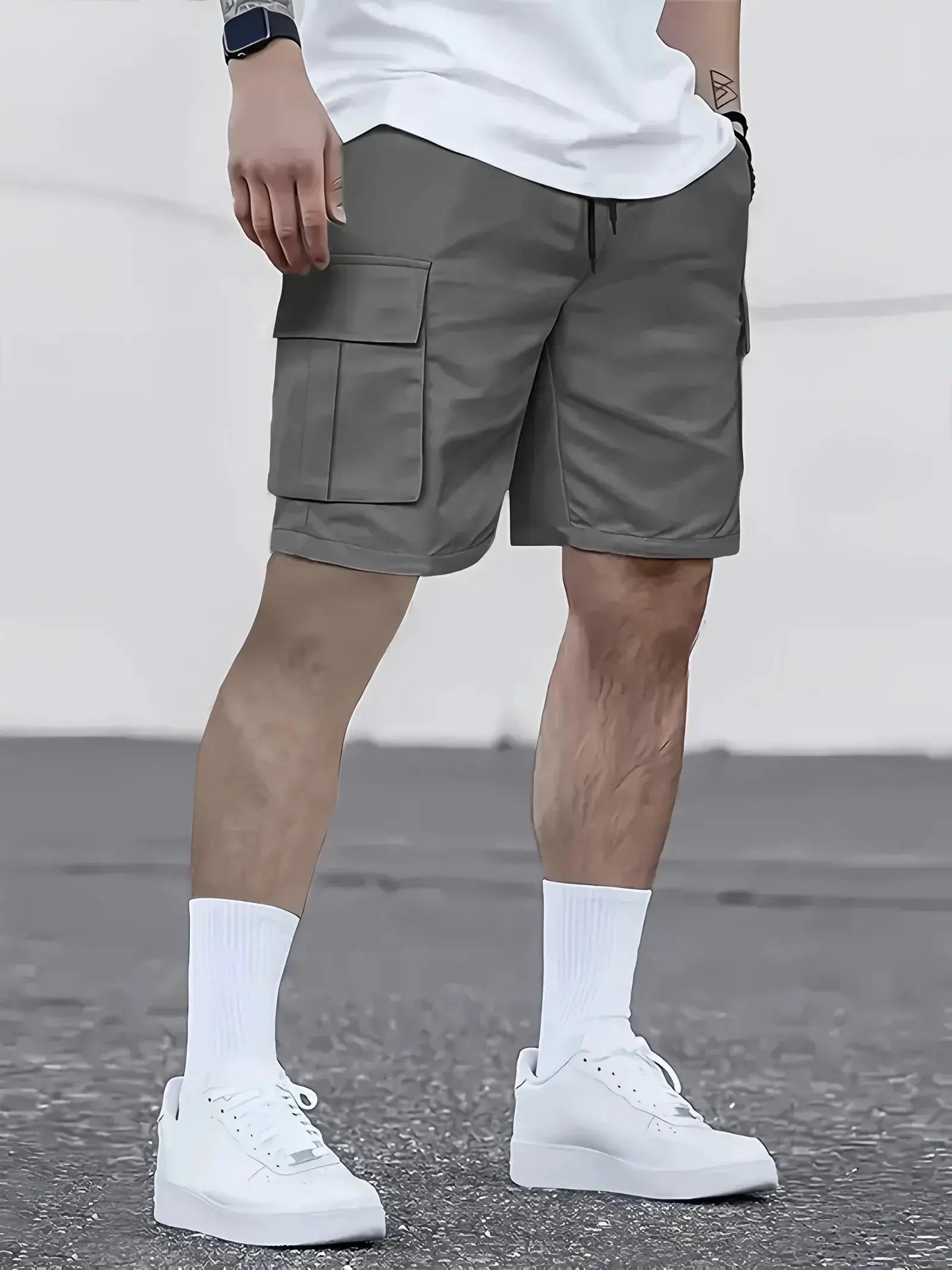 Men's gray cargo shorts with multiple pockets and elastic waistband for outdoor wear.