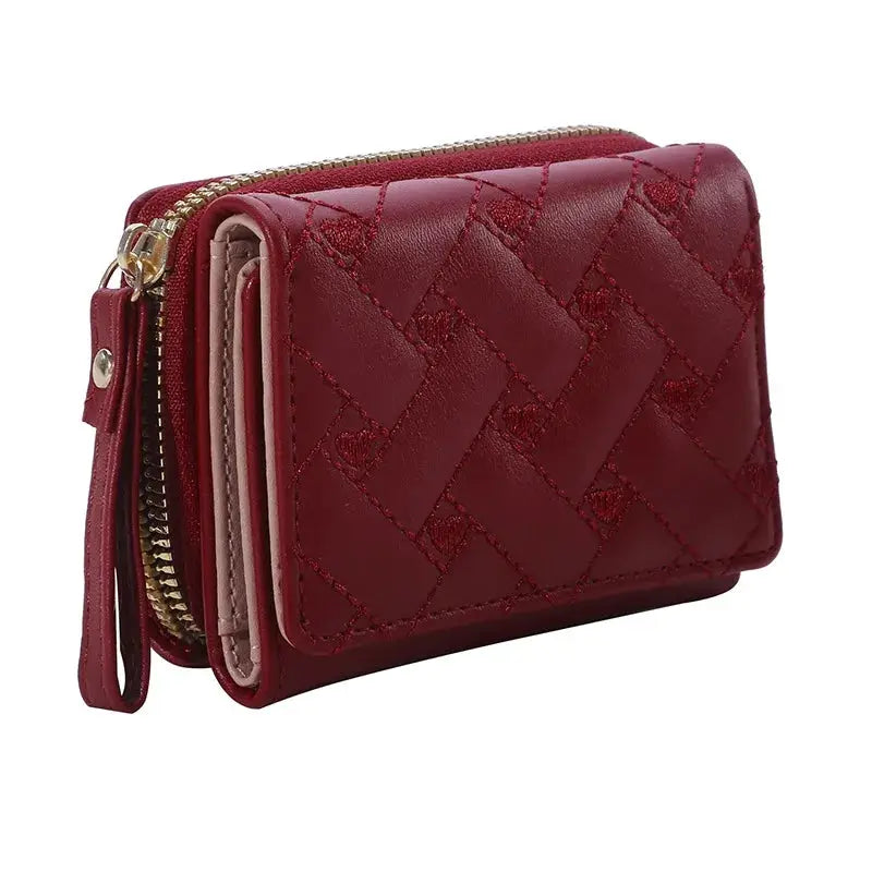 Women's red PU leather tri-fold wallet by Simples Market with quilted pattern and zippered compartments.
