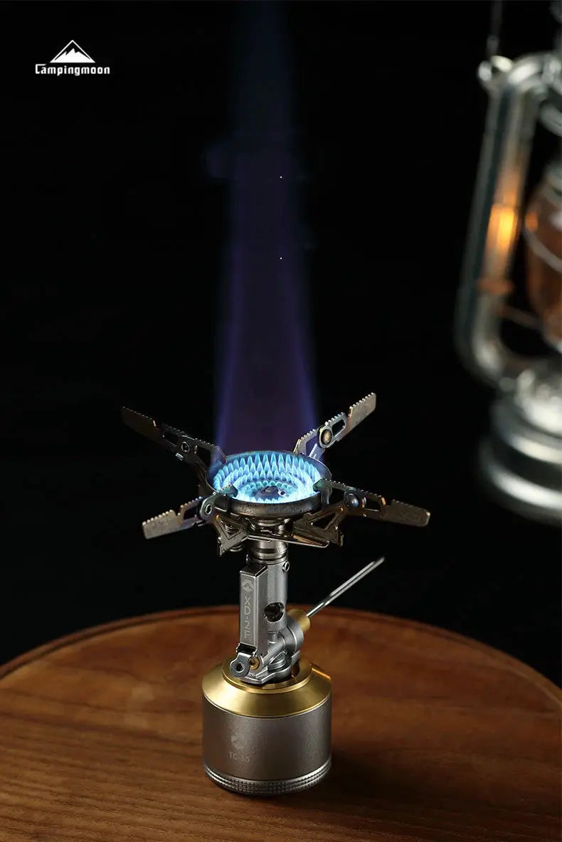 CampingMoon XD-2F outdoor portable gas stove with windproof arms and blue flame on canister