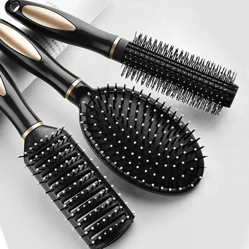 Air Bag anti-static hair brush set by Simples Market; black plastic massagers with gold trim (paddle, round barrel)