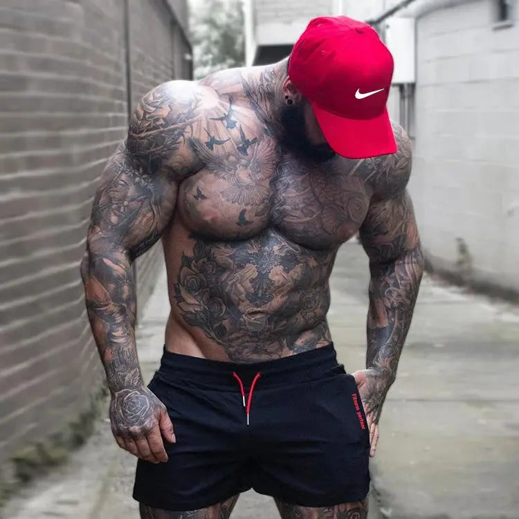 Men's black gym shorts with red drawstring, lightweight quick-drying running shorts; worn with red Nike cap