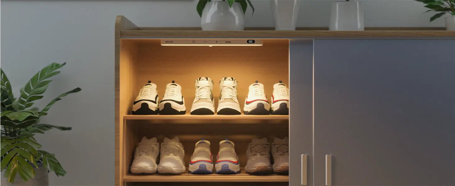 WILLED warm-light motion-sensor cabinet light; wooden shoe cabinet illuminated with 8 pairs of sneakers