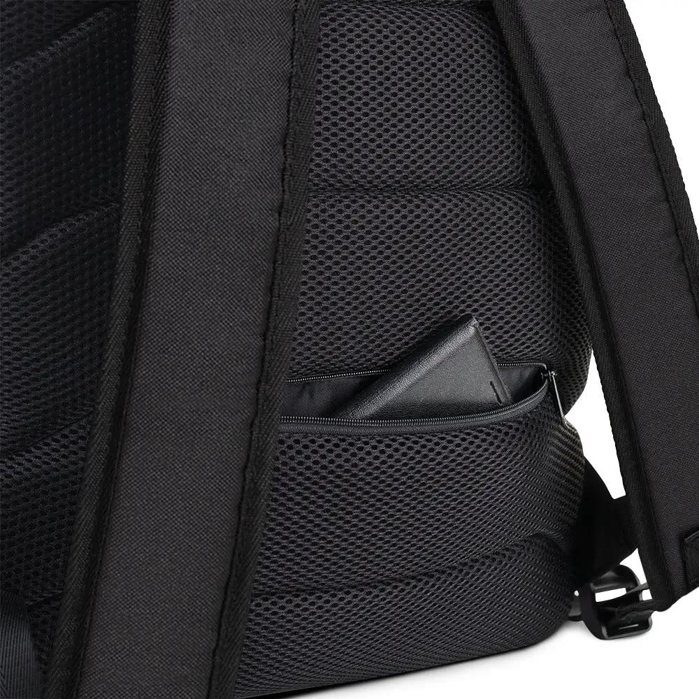 Backpack by Simples Market, black with padded straps and a mesh side pocket holding a wallet