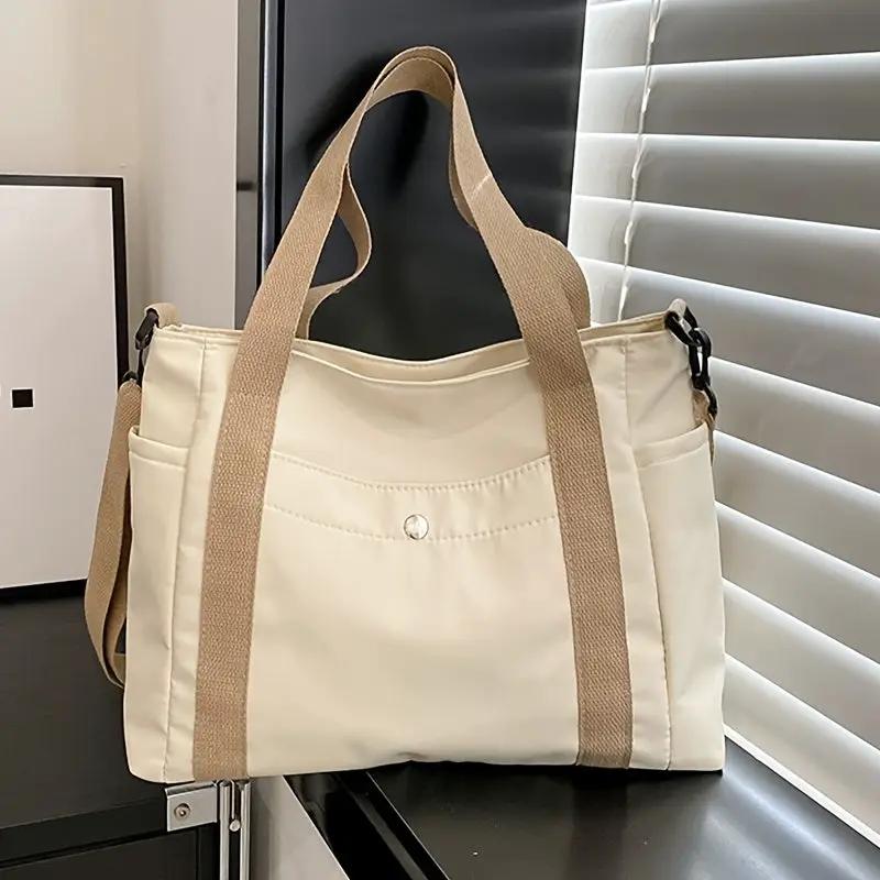 Nylon crossbody bag in beige with removable tan strap and front pocket