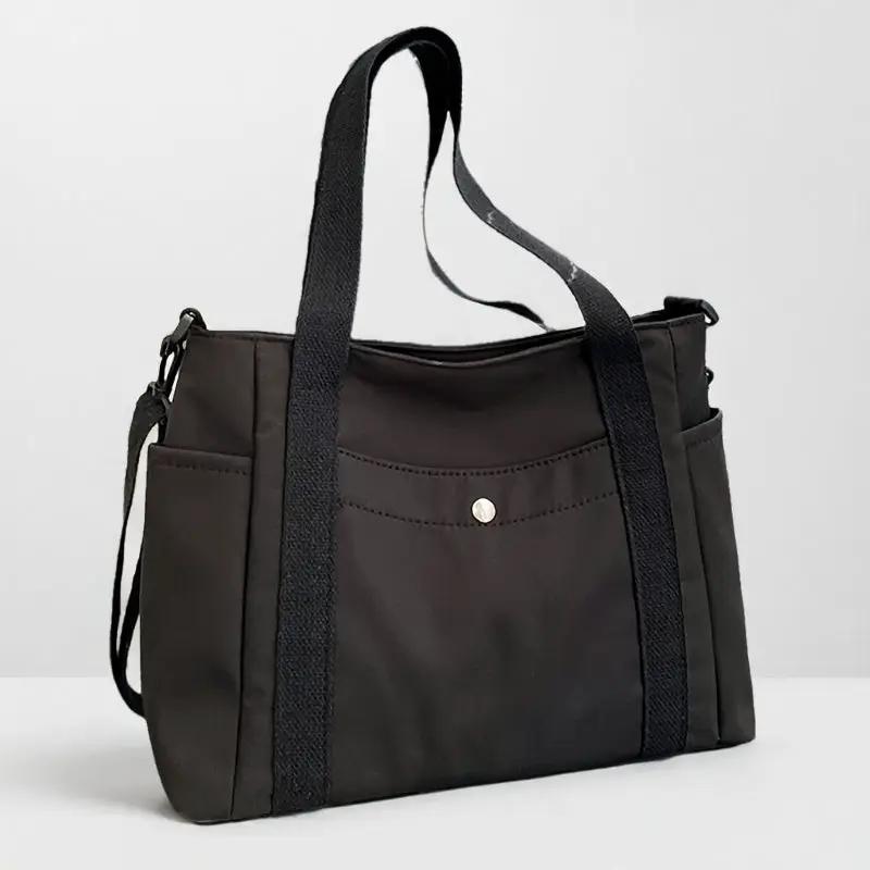 Nylon crossbody bag, large-capacity dark brown with removable strap and front pocket.