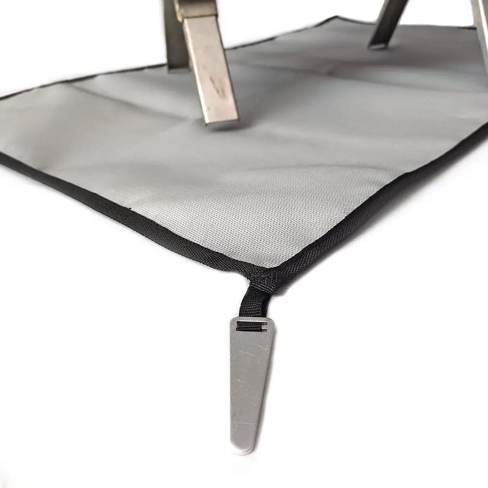 Camping fireproof cloth BBQ grill mat, flame retardant gray-silver with black edge.