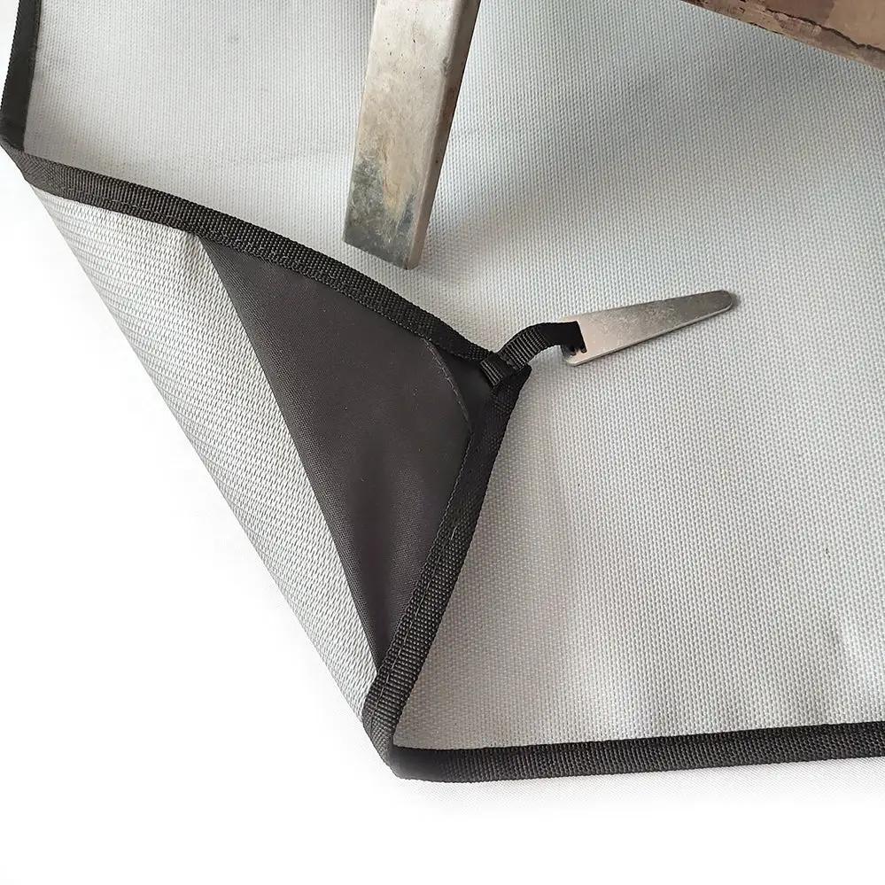 Camping fireproof grill mat for camping stoves and outdoor fires; grey heat-resistant cloth with black edge trim