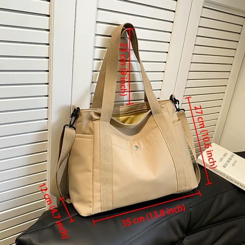 Large-capacity nylon crossbody bag by Simples Market in beige with removable shoulder strap