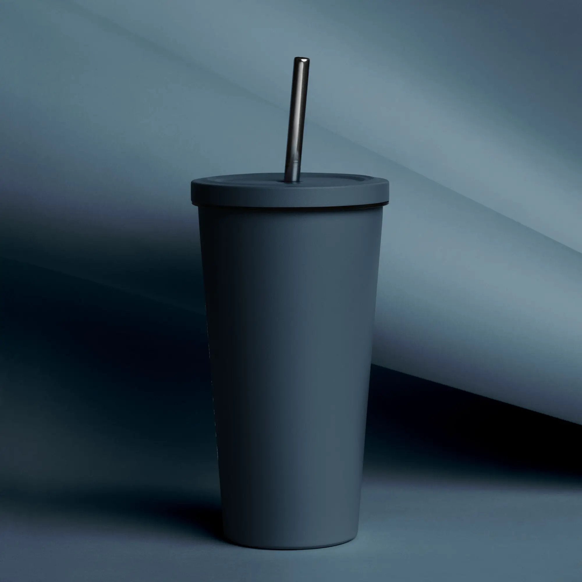 Insulated tumbler with straw in dark blue-gray, matte finish
