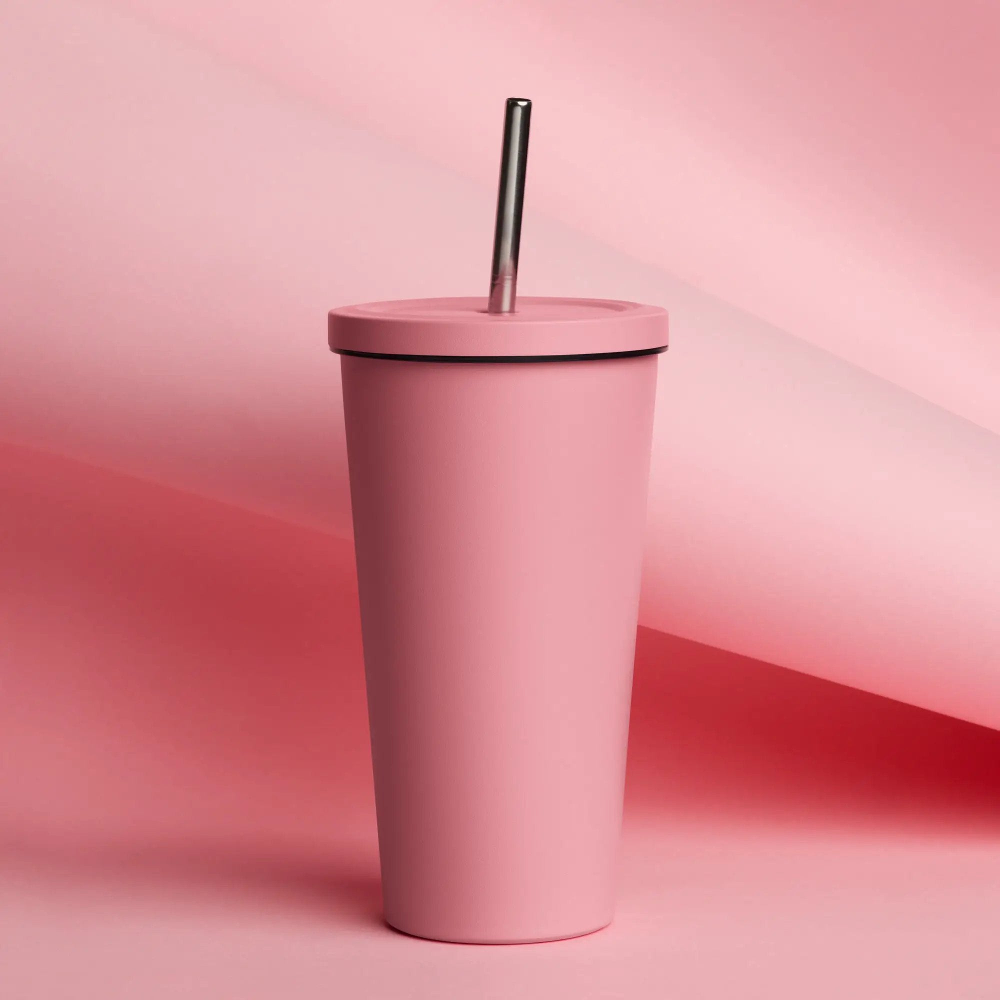 Insulated tumbler with pink body and pink lid; metal straw.