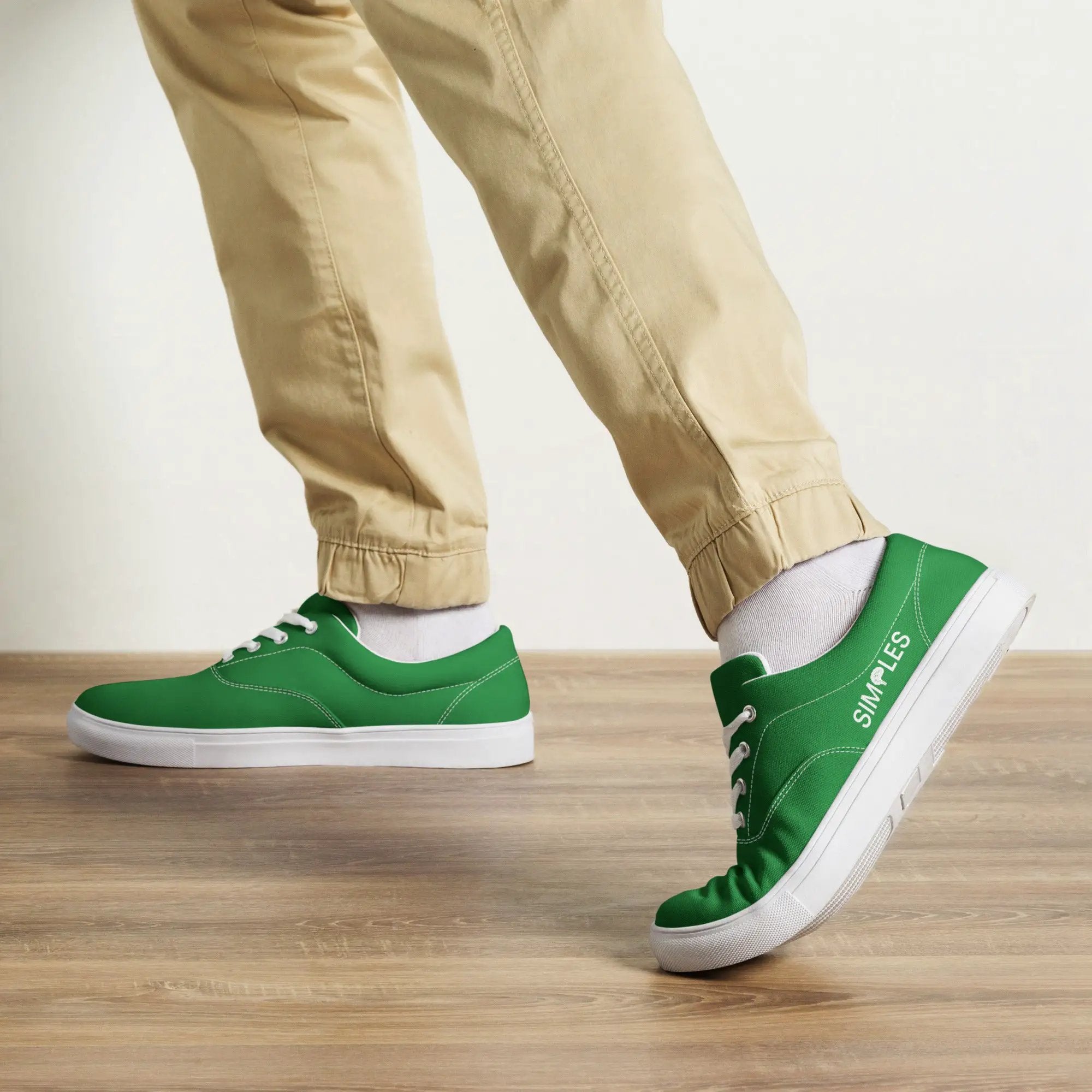 Men's lace-up canvas shoes by Simples Market; pair of green sneakers with white soles