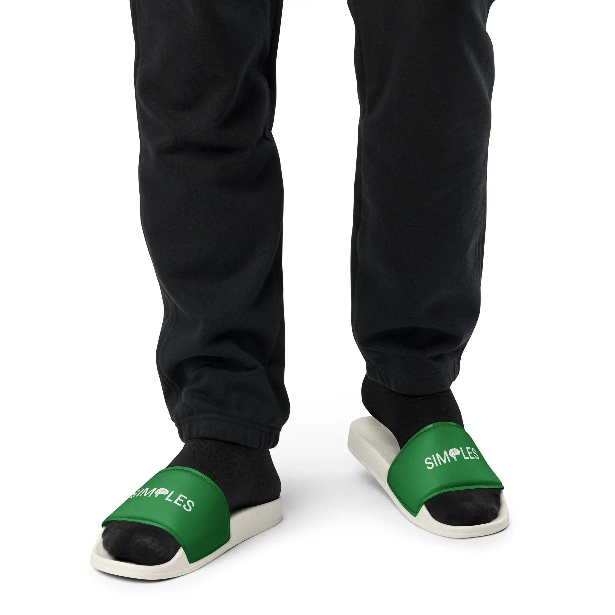 Men’s Slides by Simples Market; pair of green strap slides with white soles, SIMPLES branding visible.