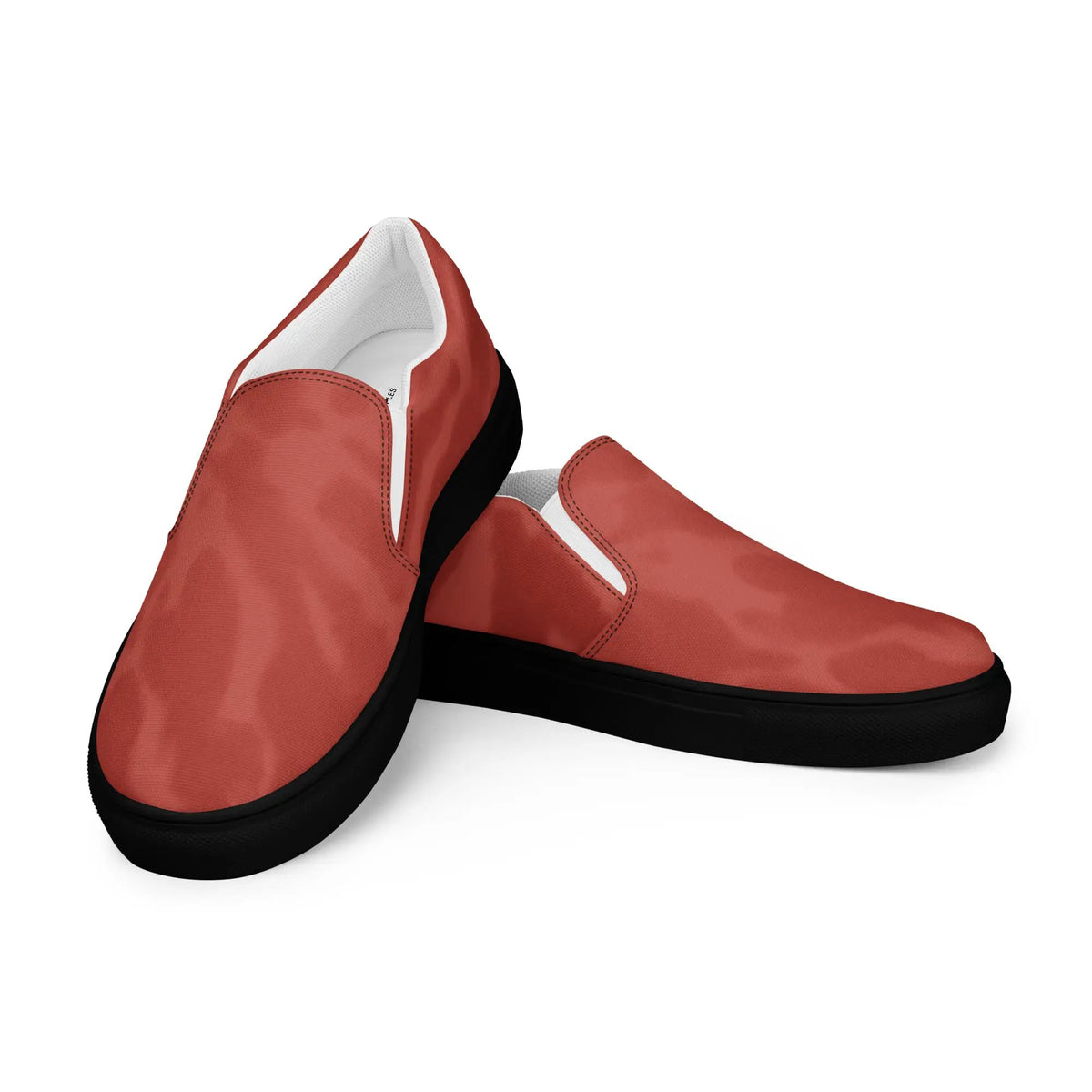 Men’s slip-on canvas shoes by Simples Market; red uppers, white lining, black soles pair