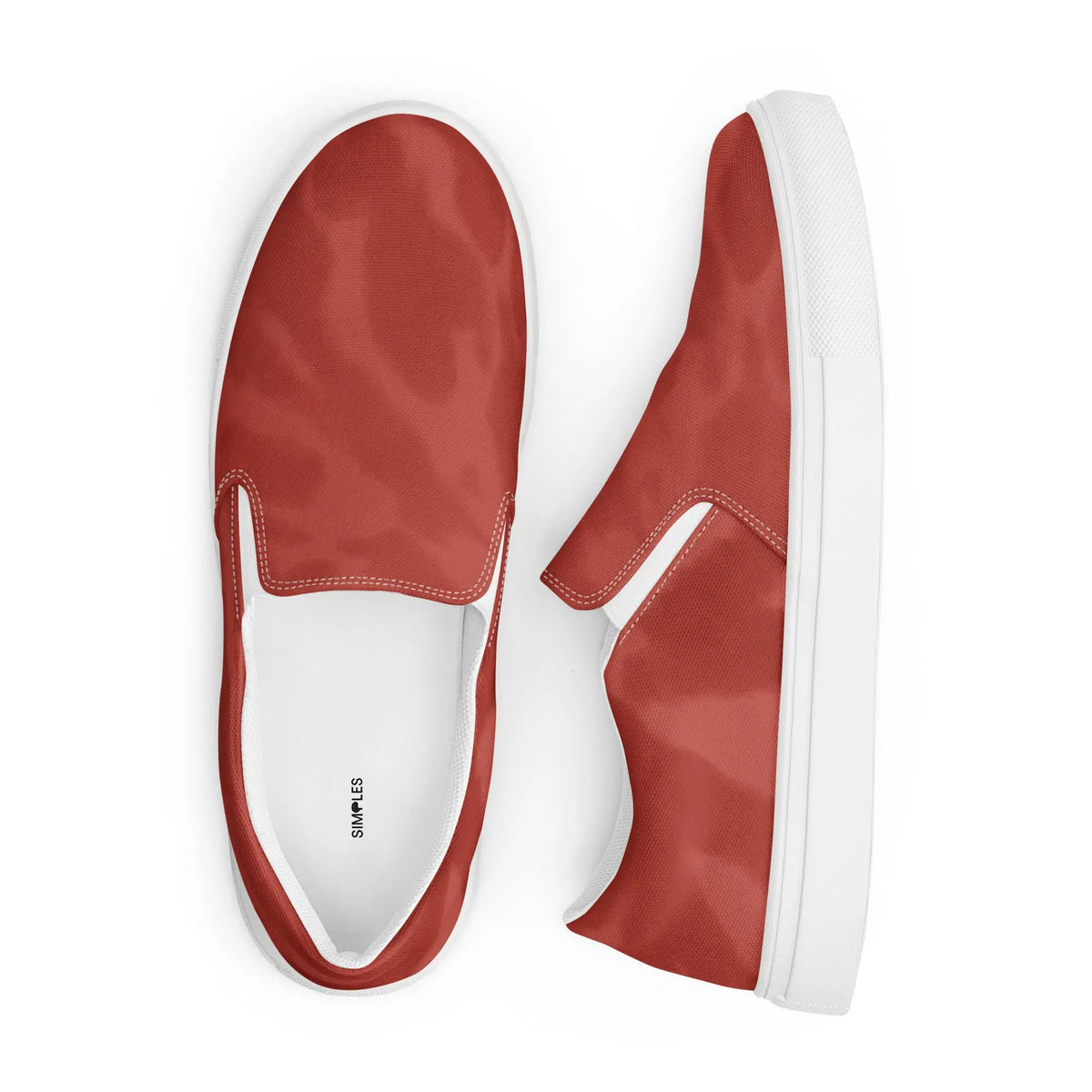 Pair of red slip-on canvas shoes by Simples Market with white soles