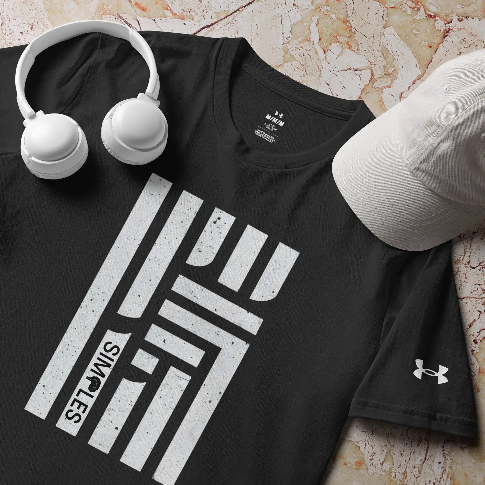 Under Armour athletic t-shirt in black with white headphones and a white cap (3 items shown)