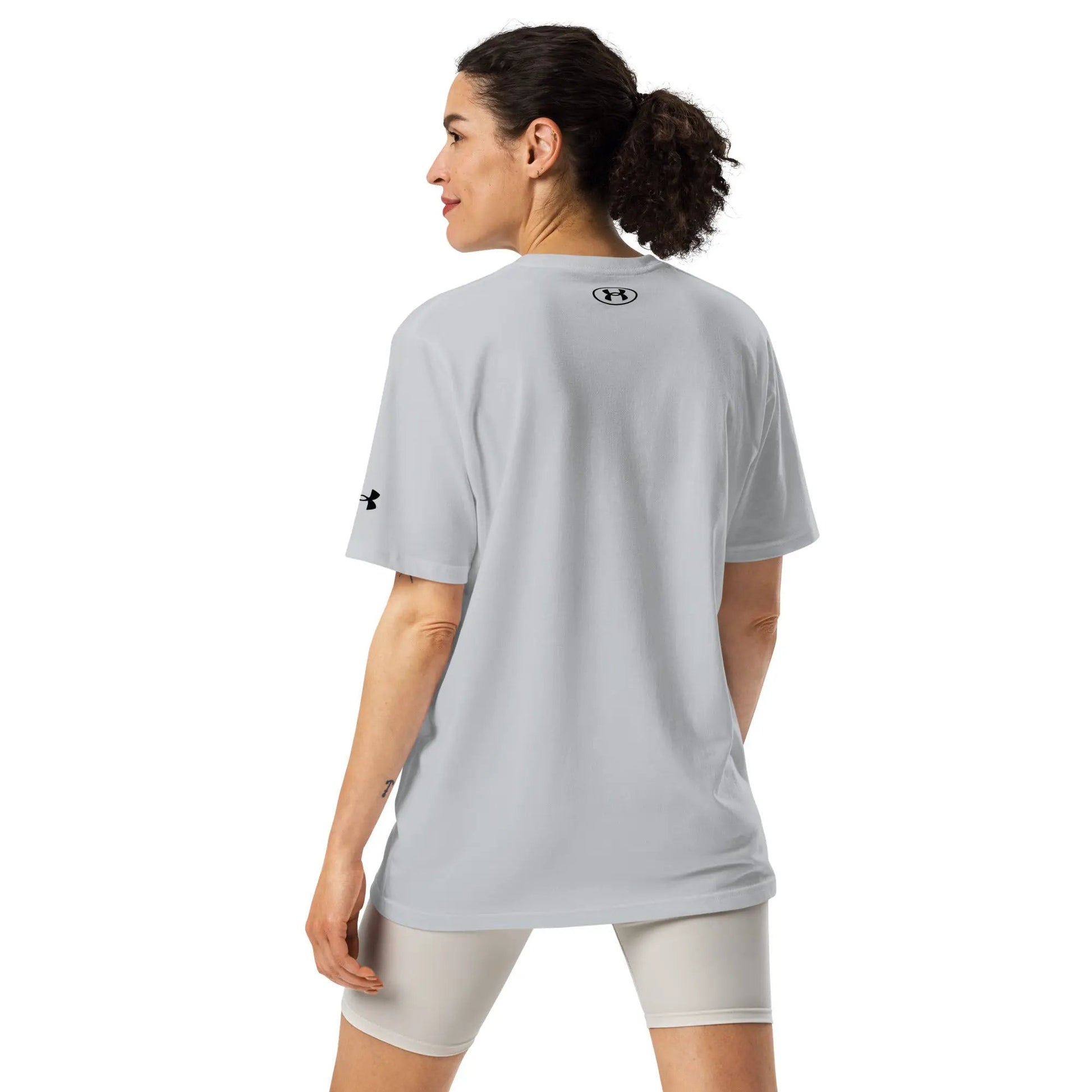 Under Armour athletic t-shirt in light gray, short-sleeve, back view with visible UA logo.