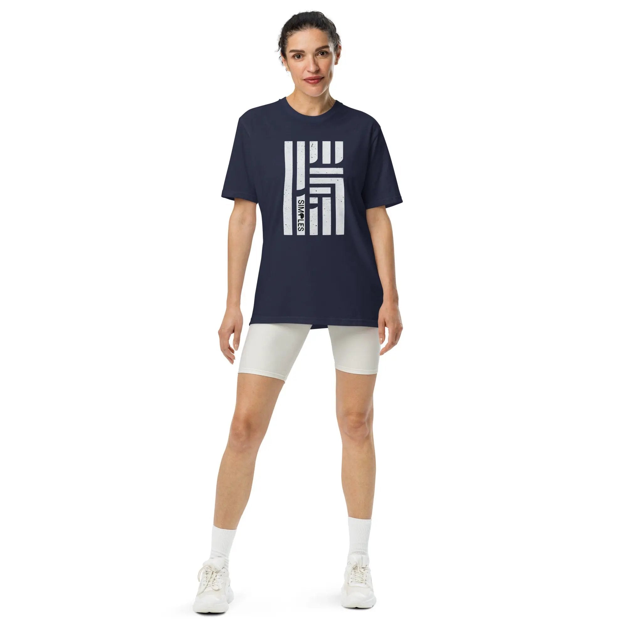 Under Armour athletic t-shirt, navy with large white geometric bar graphic, short sleeves.