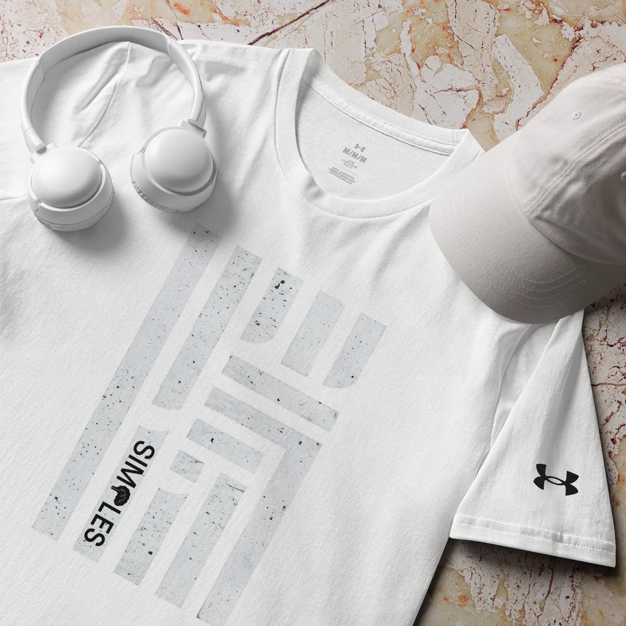 Under Armour athletic t-shirt, white; Under Armour logo visible with white headphones and a cap