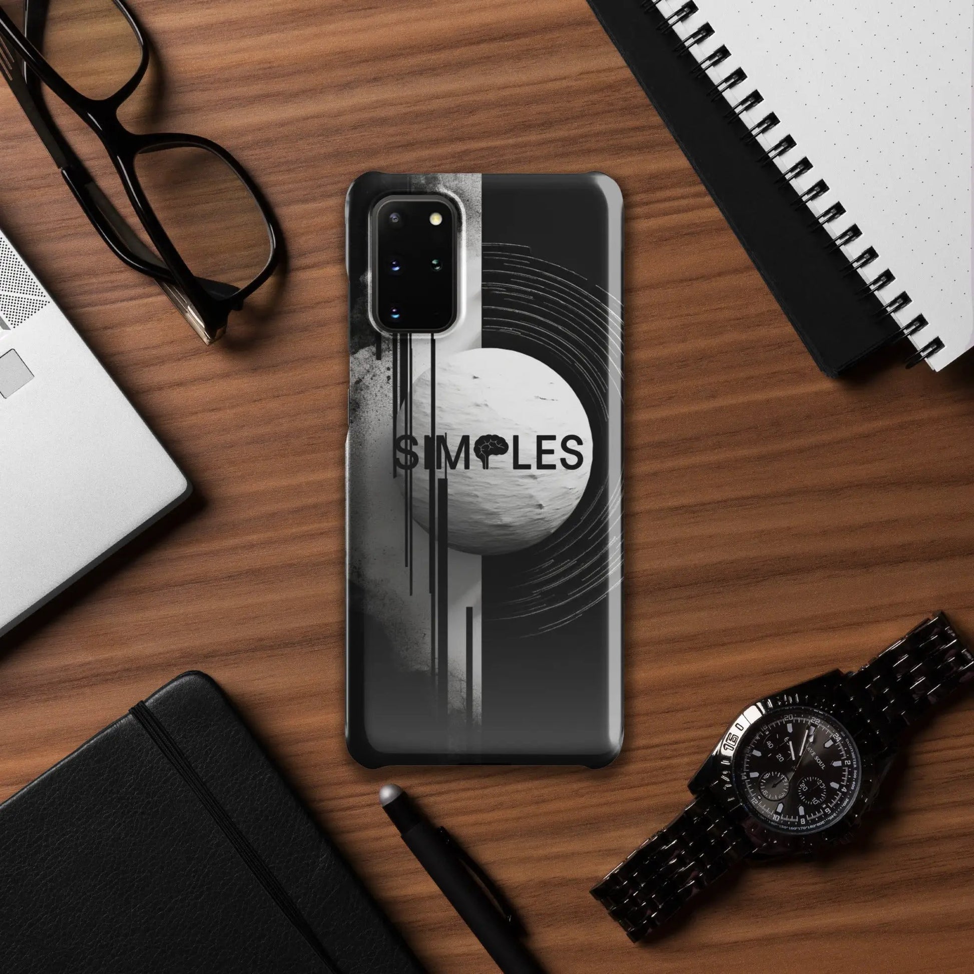 Snap case for Samsung smartphone by Simples Market; black-gray design on wood desk