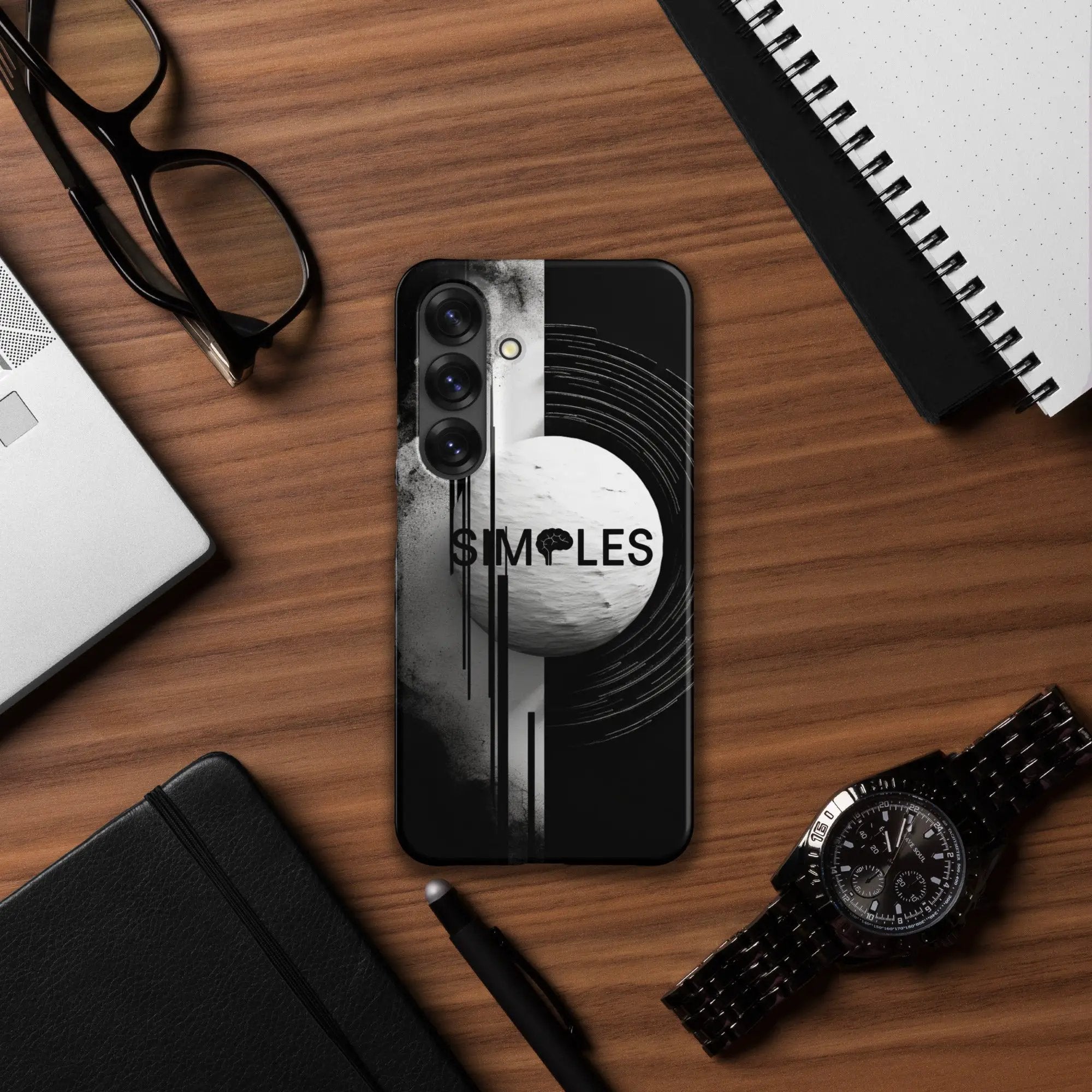 Snap case for Samsung by Simples Market, black with abstract graphic design on a wooden desk