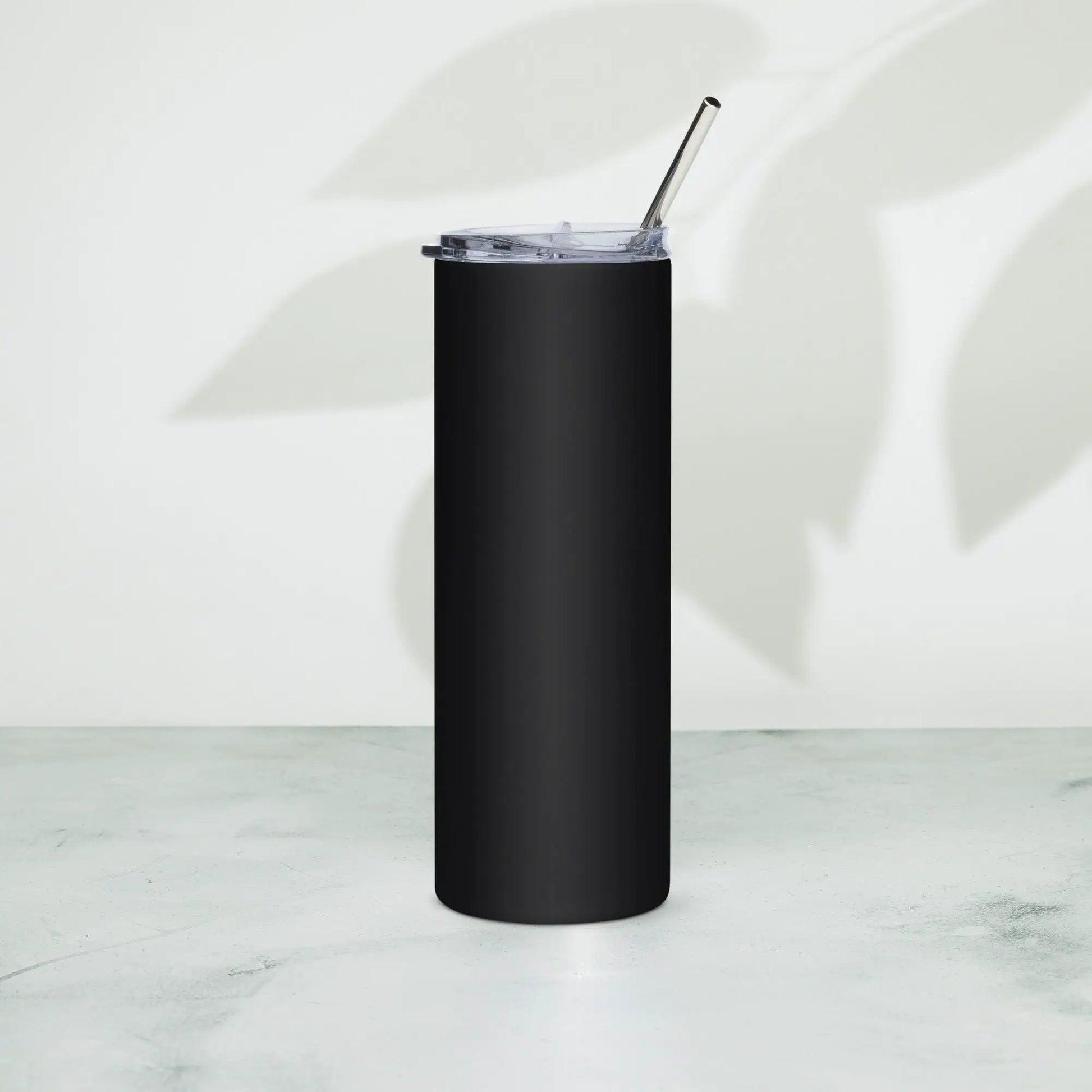 Stainless steel tumbler in black with clear lid and metal straw