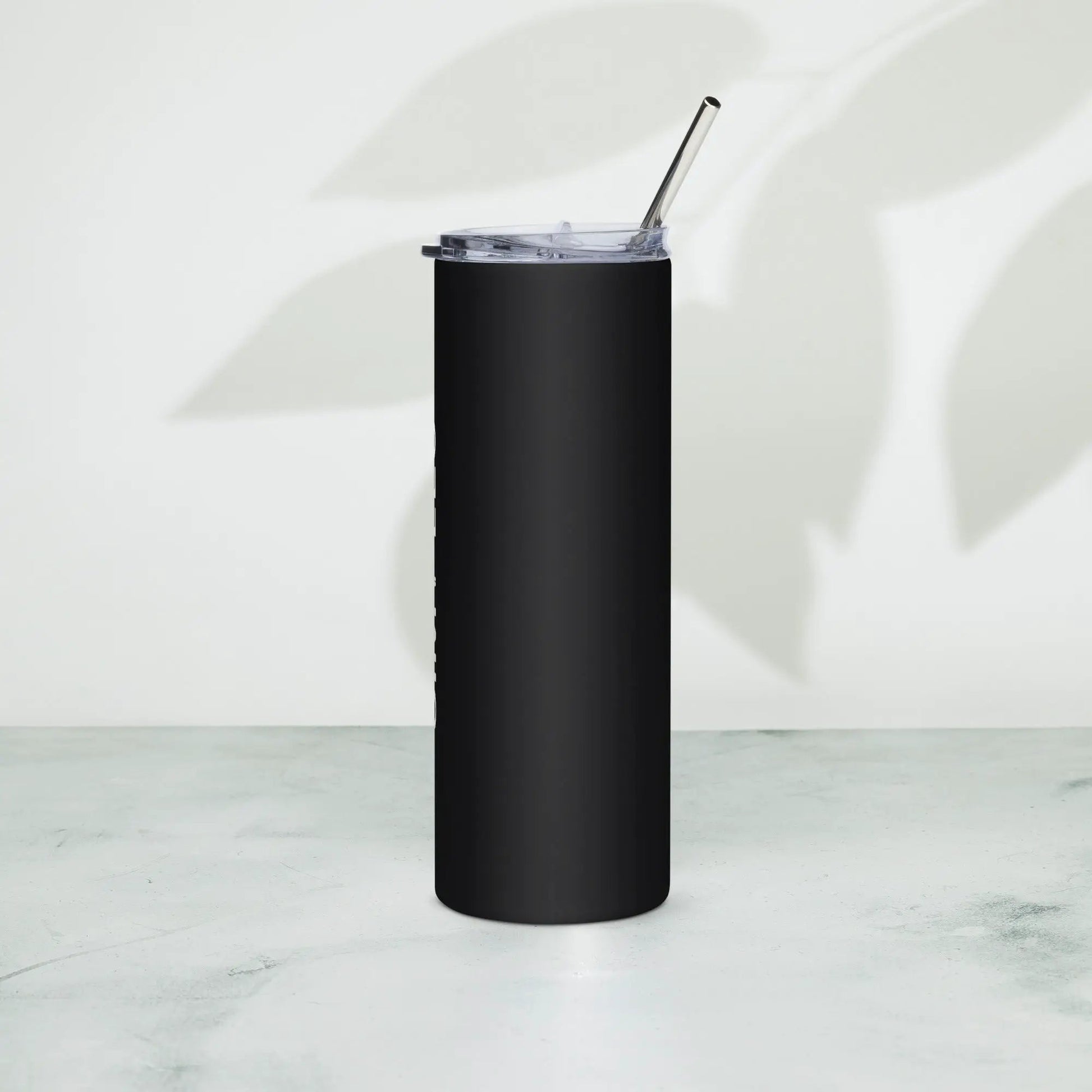 Stainless steel tumbler with black matte finish, clear lid, and metal straw