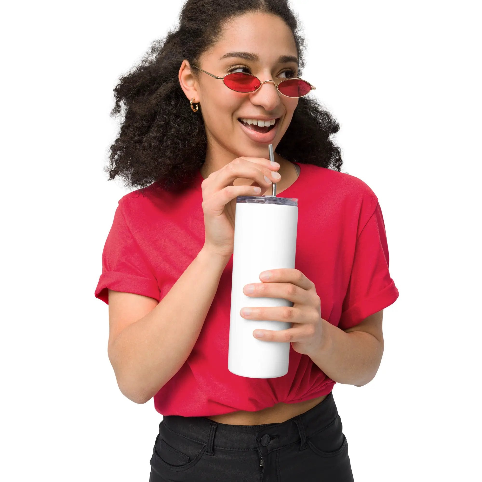 White stainless steel tumbler with clear lid and metal straw, held by a smiling woman.