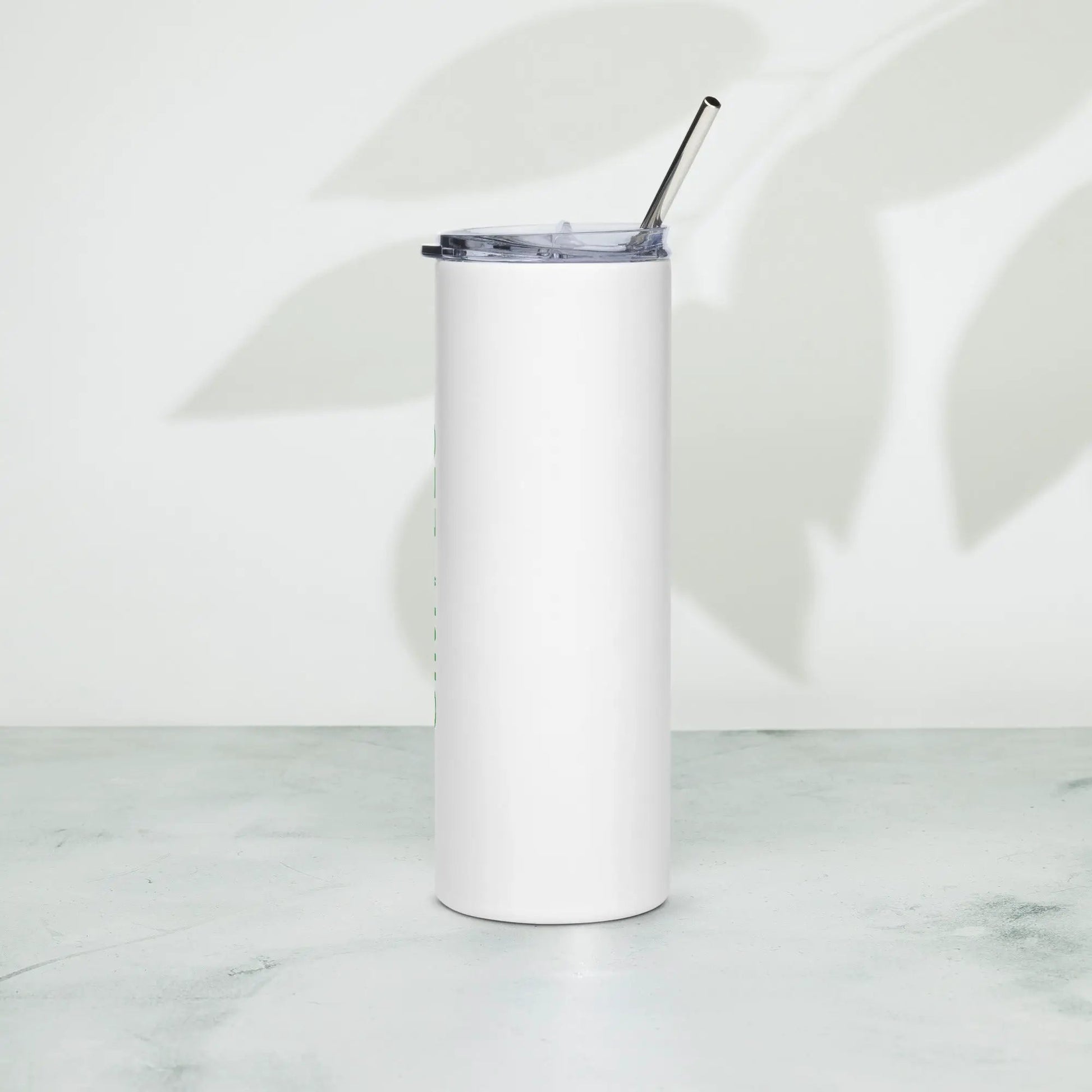 Stainless steel tumbler with white exterior, clear lid, and metal straw