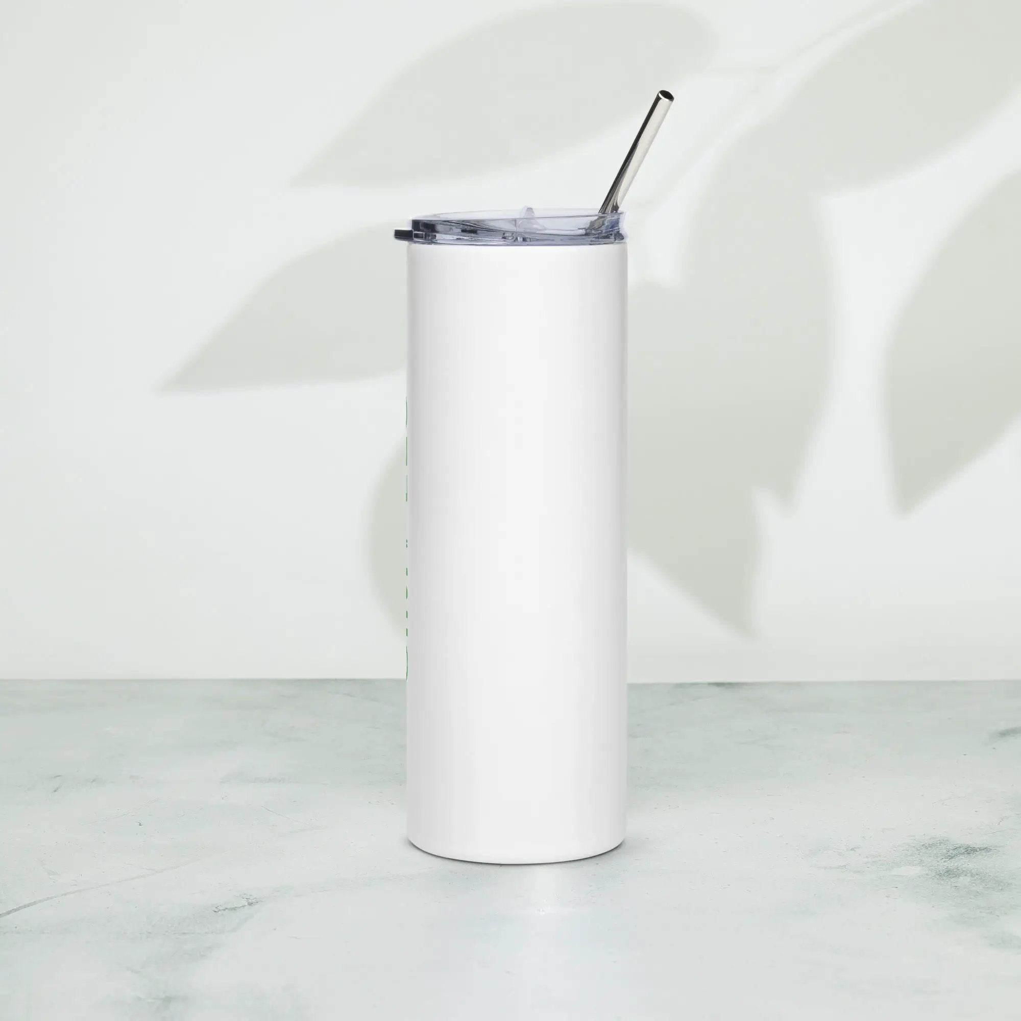 Stainless steel tumbler with white exterior, clear lid, and metal straw