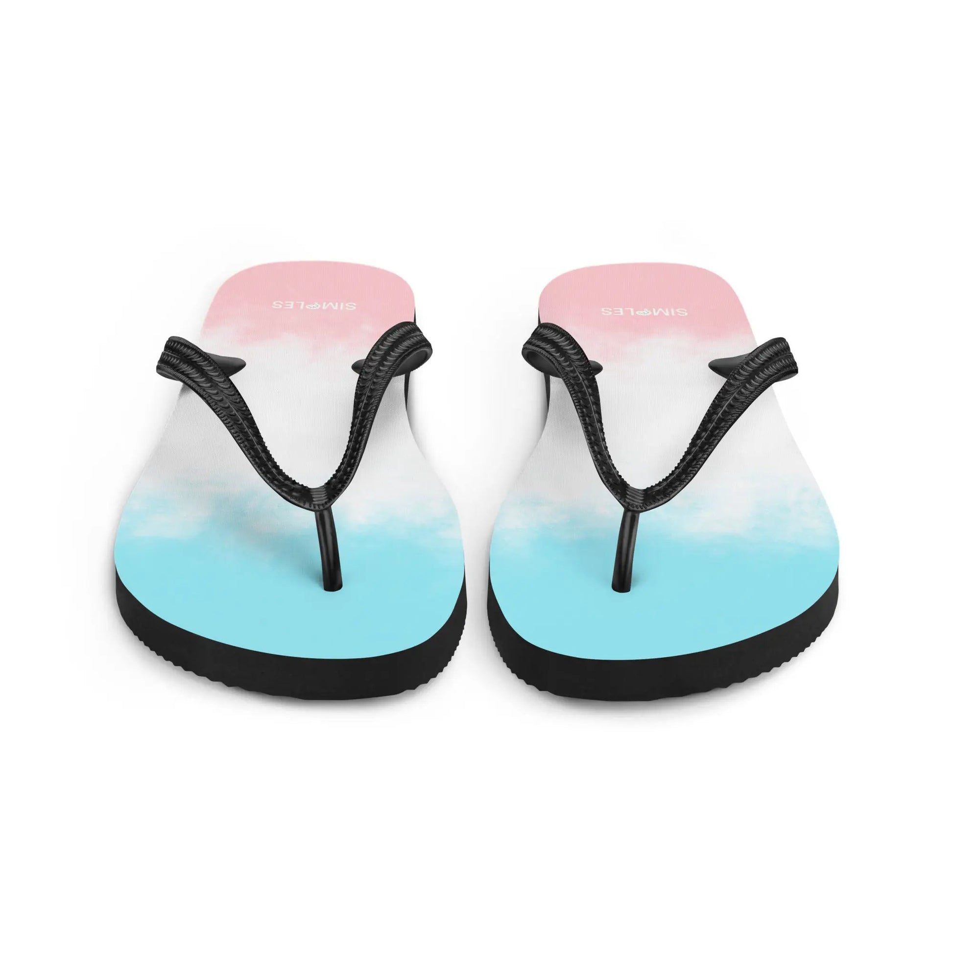Pair of Simples Market flip-flops with pink-to-blue gradient soles and black braided straps